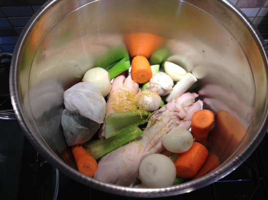 Adding the veg and herbs to the pot